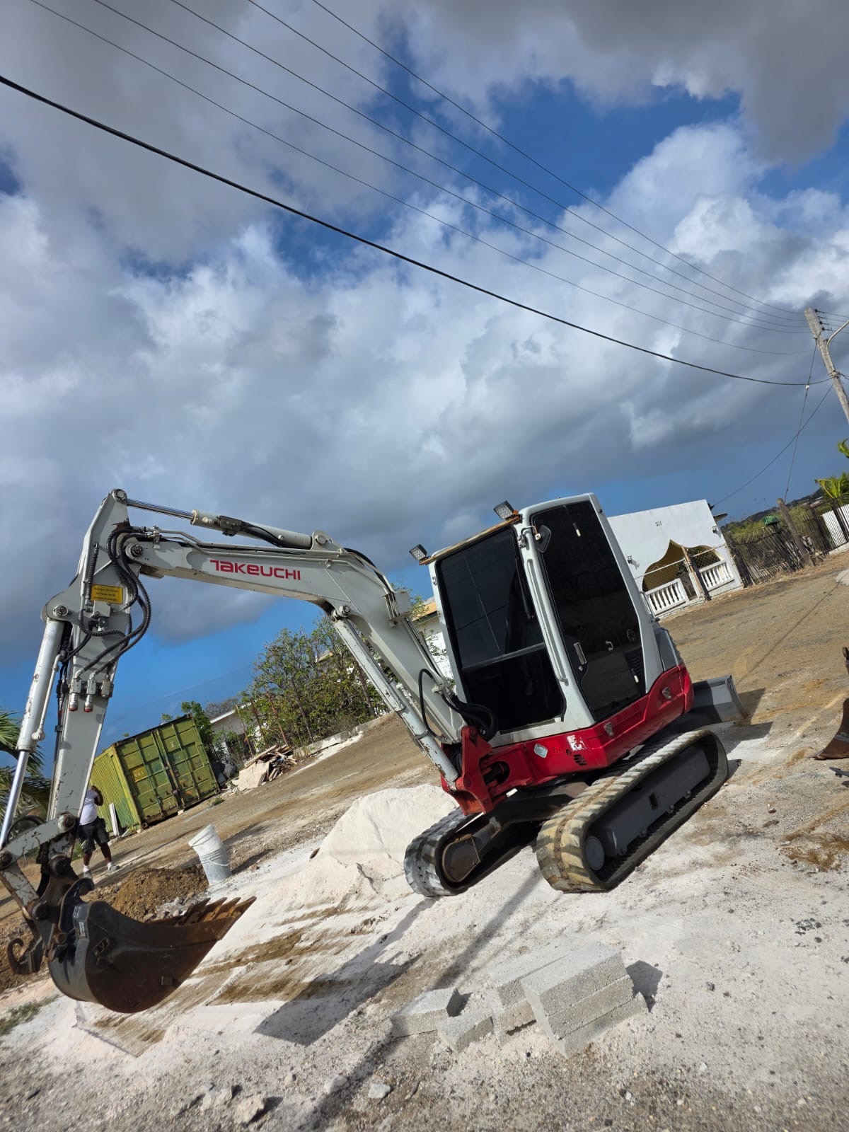 JDS Takeuchi excavator working on a construction site in Curaçao